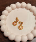 Pink studded heart earrings
