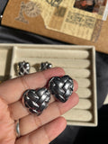 Heart knotted silver earrings